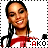 A pixelated image of a person with dark braided hair wearing a white shirt with red accents, smiling with eyes closed, displayed in a with repeated elements