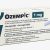 Static pixelated image with partial text reading 'OZEMPI' on left, dark rectangular shape on right, and scattered grayscale pixels across center.