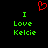 Red pixelated heart symbol above green text reading 'I Love Kelcie' on black background.