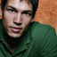 A person in a green polo shirt against an orange textured background, with text overlays changing across six