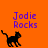 Pixelated black cat walks left on orange background with purple text 'Jodie Rocks' above; right-side view shows partial gray area.