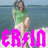 A person in a green shirt and light shorts sits on a beach with water behind them, overlaid with bright pink text.