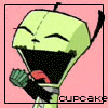 A green cartoon character with closed eyes and a wide open mouth holds a red object, with 'cupcake' text below.