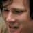 A pixelated close-up of a person's face with two side-by-side views showing subtle facial expression changes, including mouth and eye positioning differences.