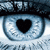 A close-up of a blue eye with a black heart-shaped pupil, showing subtle variations in iris texture and eyelash detail across frames.