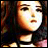 A 48x48 pixel buddy icon featuring a side-profile of a character with long dark hair and light skin, alongside stylized text on a black background.