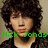 A four- shows a person with curly brown hair in a dark jacket against a beige background, with green text overlays in the top-left and bottom-left