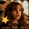 A person with long brown hair and a yellow star symbol appears in two side-by-side frames, wearing dark clothing with a white collar.