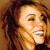 A split-frame contact sheet showing a pixelated portrait of Mariah Carey on the left and green text reading "Original Icons .com" on a dark green background on the right.