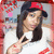 Pixelated image of a person with long dark hair wearing a red and black cap, white shirt, and visible arm tattoos.