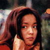 A four- shows a person with long brown hair in different poses and lighting conditions, with the bottom-right blank