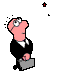 Pixelated cartoon character in black suit holding gray briefcase, pink skin, round glasses, standing against light gray background with scattered star shapes.