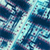 A pixelated abstract composition of blue, teal, and purple hues with scattered light and dark patches forming an indistinct pattern.