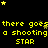 Yellow pixelated text and stars on a black background with repeated phrases 'there goes a shooting star' in multiple