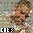 Pixelated static image of a person with light brown hair and dark eyes, wearing a white top against a muted background with text reading CHAIS at bottom left.