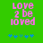 Green background with pink pixelated text reading 'Love 2 be loved' and blue star-like symbols below, showing animation changes in symbol positions.