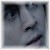 A pixelated grayscale icon shows a partial face with dark hair and a dark object on the right side of the frame.