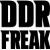 Black and blue pixelated text on white background: 'DDR FREAK' in large bold letters left, 'I'm A DDR Boy' in smaller blue letters right.