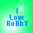 Green background with blue text reading "I Love Bobby" in pixelated font, four identical arranged in a