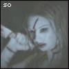 A static image of a pale-skinned figure with red markings on the face, holding an object near their shoulder.