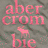 A static image of a gray fabric with pink text 'aber crom bie' and a small moose icon, alongside a of colorful square icons featuring various animal motifs