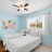 Pixelated image showing a light blue wall with two framed pictures, one on each side of a central white object resembling a sink or counter.