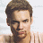 A 48x48 pixel buddy icon split into two frames showing a person's face on the left and green text on a dark background on the right, with visible pixelation and dithering effects.