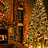 A pixelated static image with warm brown and orange tones, featuring indistinct shapes and patterns that suggest a blurred or low-resolution scene with no clear subjects or text.
