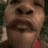 Six -aligned facial expressions of a person with closed eyes and mouth in various states of opening, set against a blurred green background