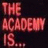 Pixelated red text on dark background reads THE ACADEMY IS, with visible pixelation and no additional elements.