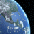 Pixelated Earth view on left, green text 'Original Icons .com' on right against dark background.