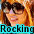 A four- shows a person with red hair and sunglasses, a person with long hair holding a camera, and text reading 'Rocking Avril' in cyan