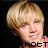 A 48x48 pixel animated contact sheet showing two frames of a cartoon-style character with blonde hair and pink clothing against a black background, displaying slight facial expression changes between frames.