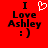 Red background with black text reading "I Love Ashley :)" and a white pixelated heart symbol above the word "Love", displayed in two side-by-side frames.