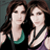 Two women with long brown hair pose side-by-side against a dark background, one in a black top with teal trim and the other in a purple sleeveless top.