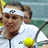 Pixelated static image of a tennis player in mid-action with a yellow ball and racket, wearing white headband and shirt against blurred green background.