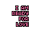 Pixelated text "I AM READY FOR LOVE" in pink and black with small animated hearts floating around it on a white background.
