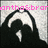 Pixelated image with pink text at top and dark abstract shape below on light gray background.