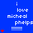 Blue background with white text reading "i love micheal phelps" and red star icons, arranged in a pattern