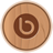 Circular wooden icon with a brown spiral symbol at center, rendered in pixelated style with light brown and dark brown tones.