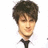 Pixelated image of a person with dark hair and light skin wearing a white shirt and black tie, next to blue background with 'HOT' text.