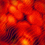 A pixelated image of a red-orange floral arrangement with a gray rectangular overlay in the bottom-right corner.