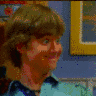 A 4-frame contact sheet of a cartoon animation featuring a boy and a large anthropomorphic character with exaggerated facial features, showing sequential actions in an indoor setting.