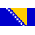 Static pixelated icon featuring a diagonal blue and yellow flag design with white dots along the boundary, set against a gray background.