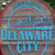Pixelated blue and red icon with 'DELAWARE CITY' text, featuring a ship silhouette within a circular frame on a brown background.