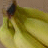 A split-screen image with a pixelated banana on the left and yellow background text 'go BANANAS' on the right.