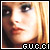 Pixelated close-up of a person's face with blonde hair and visible facial features, including eyes, nose, lips, and skin texture, set against a light background with the text "GURL" at the bottom in blocky pixel art style.