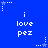 Blue background with white pixelated text "i love pez" repeated in a , surrounded by small star and dot patterns