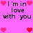 Pixelated pink background with black text reading "I'm in love with you" surrounded by red and pink heart icons.