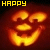 Animated pumpkin face with glowing orange eyes and mouth, transitioning from 'HAPPY' text to 'HALLOWEEN' text above.